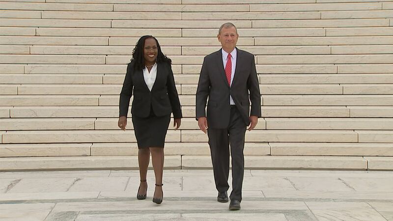 Justice Ketanji Brown Jackson, left, is escorted by Chief Justice of the United States John...