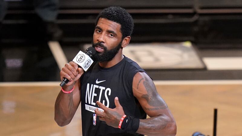 FILE - Brooklyn Nets' Kyrie Irving speaks before the team's NBA basketball game against the...