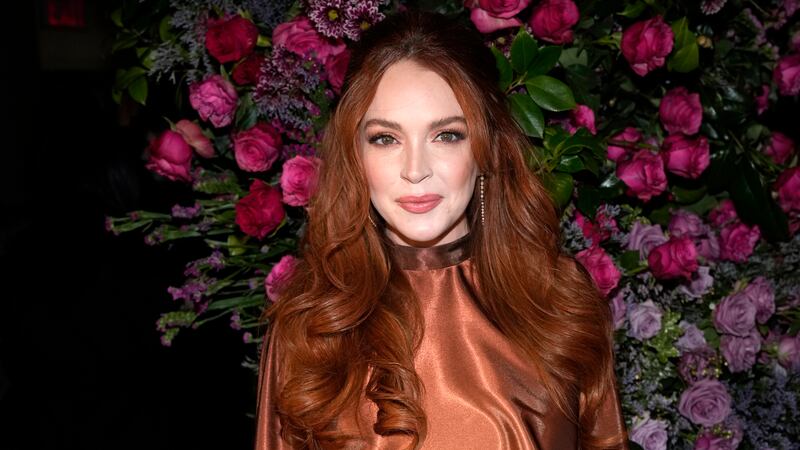 FILE - Actress Lindsay Lohan appears at the Christian Siriano Fall/Winter 2023 fashion show in...