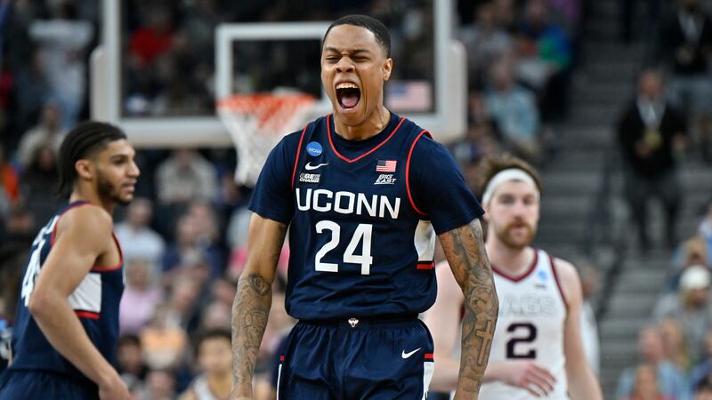 UConn guard Jordan Hawkins (24) celebrates in the second half of an Elite 8 college basketball...