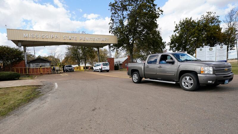 FILE - Traffic leaves the front gate to the Mississippi State Penitentiary in Parchman, Miss.,...