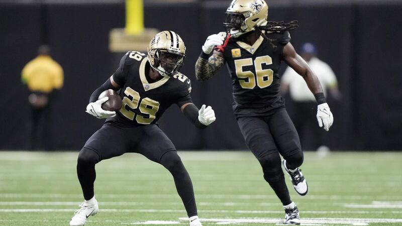 New Orleans Saints cornerback Paulson Adebo (29) runs after intercepting a pass during the...