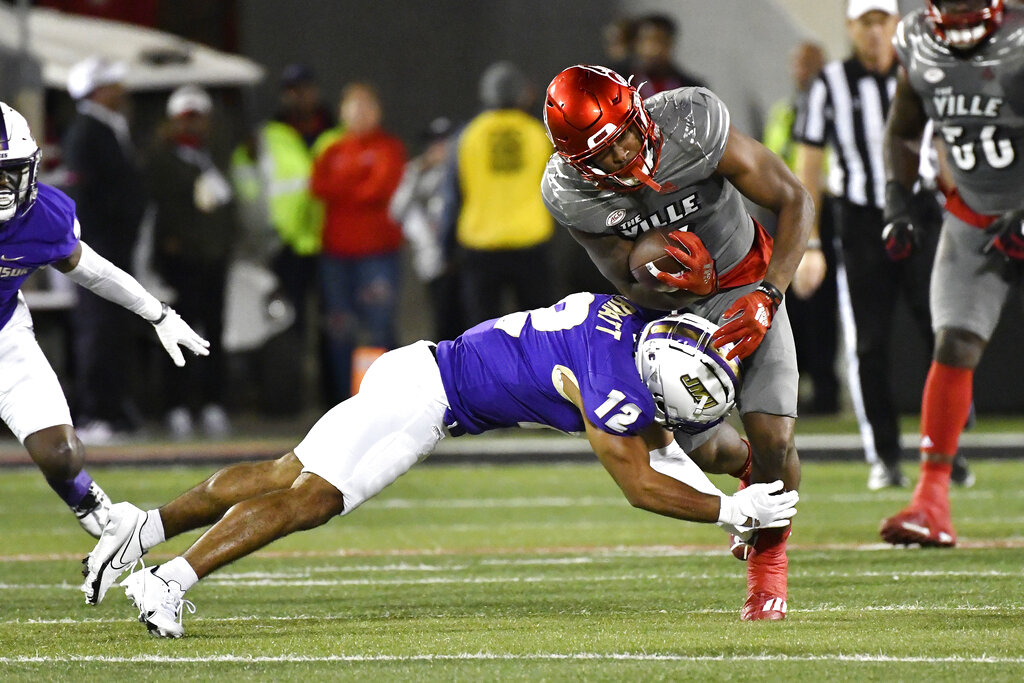 James Madison safety Josh Sarratt (12) tackles Louisville quarterback Malik Cunningham (3)...