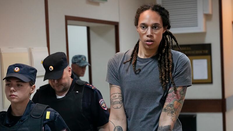 FILE - WNBA star and two-time Olympic gold medalist Brittney Griner is escorted from a...